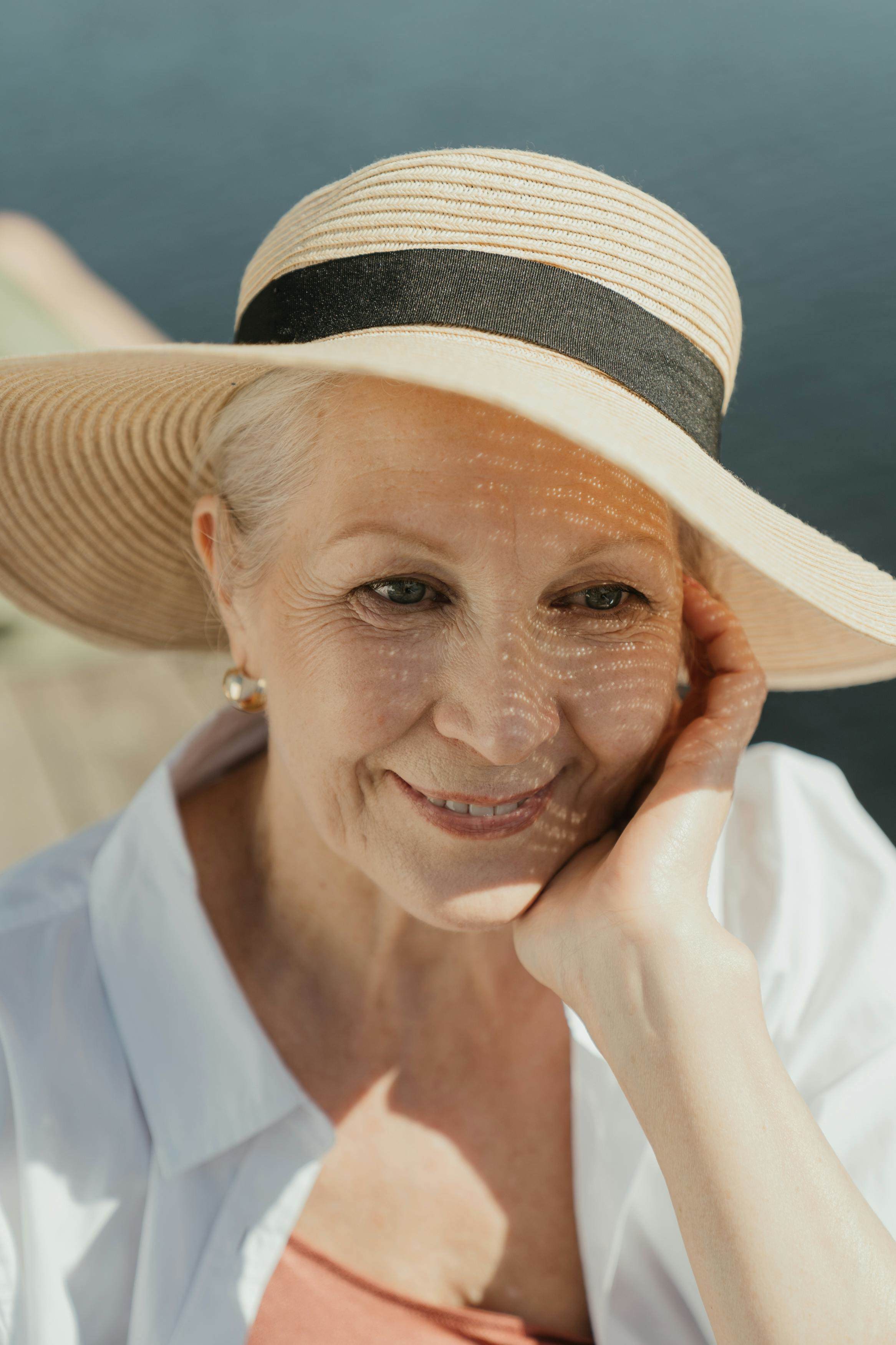 Elderly women in the sun with sun hat
